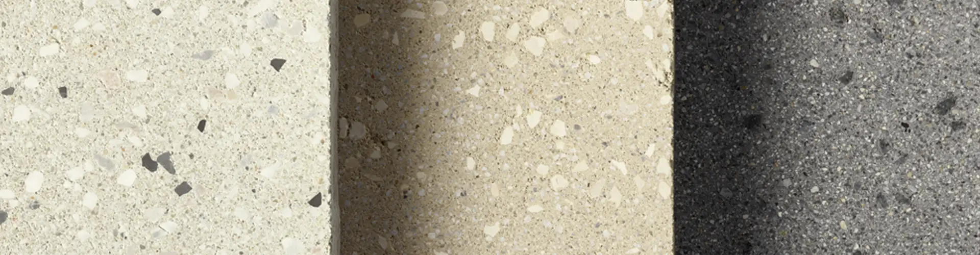 Creazzo Oberflächenmuster in mehreren hellen und grauen Nuancen in Terrazzo-Optik, nebeneinander angeordnet, Friedl Steinwerke.